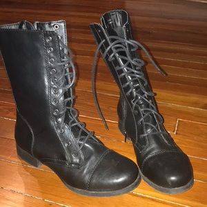 Black laced boots with a side zipper